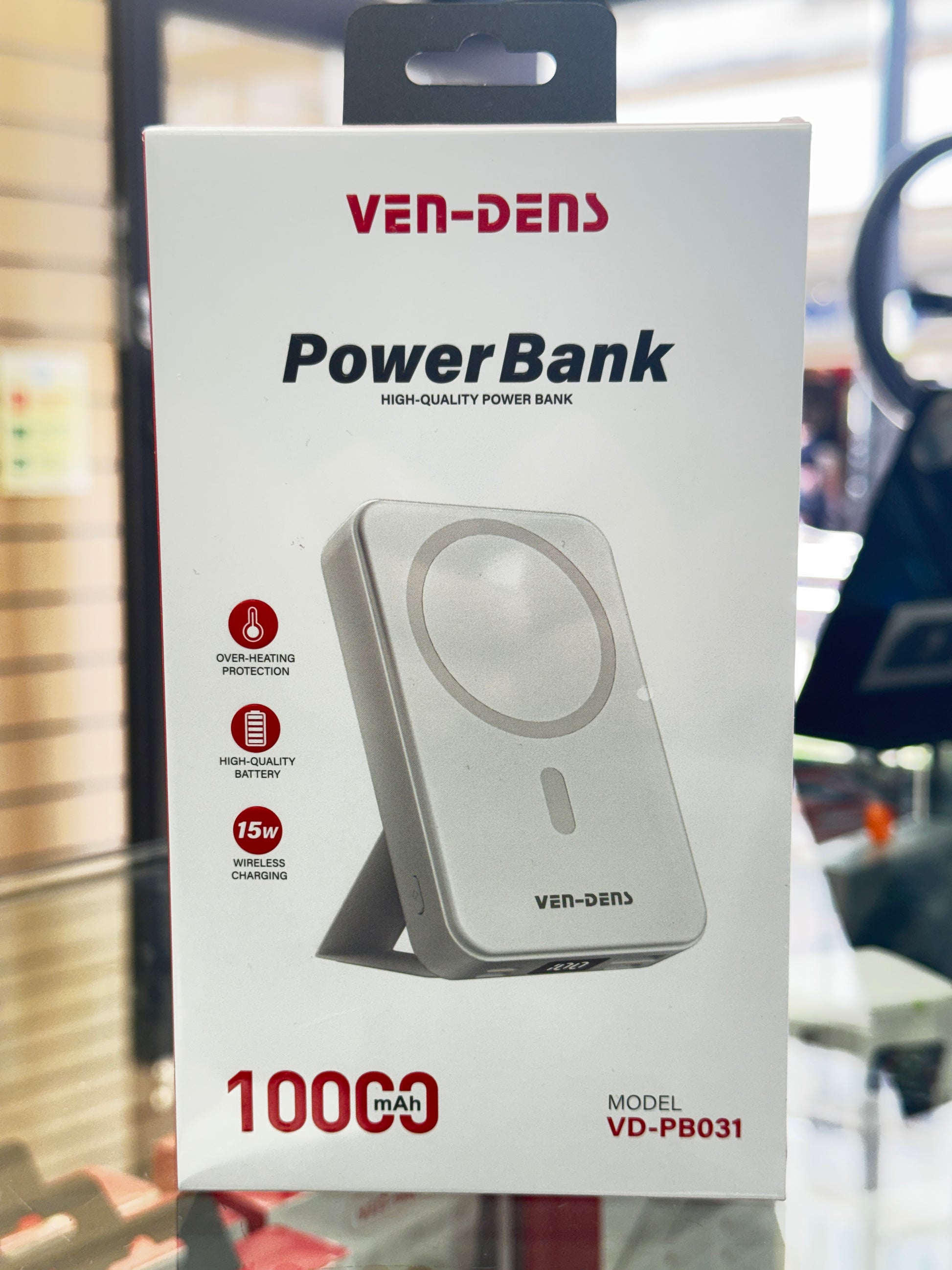 Power bank packaging with Ven-Dens branding on a blurred background