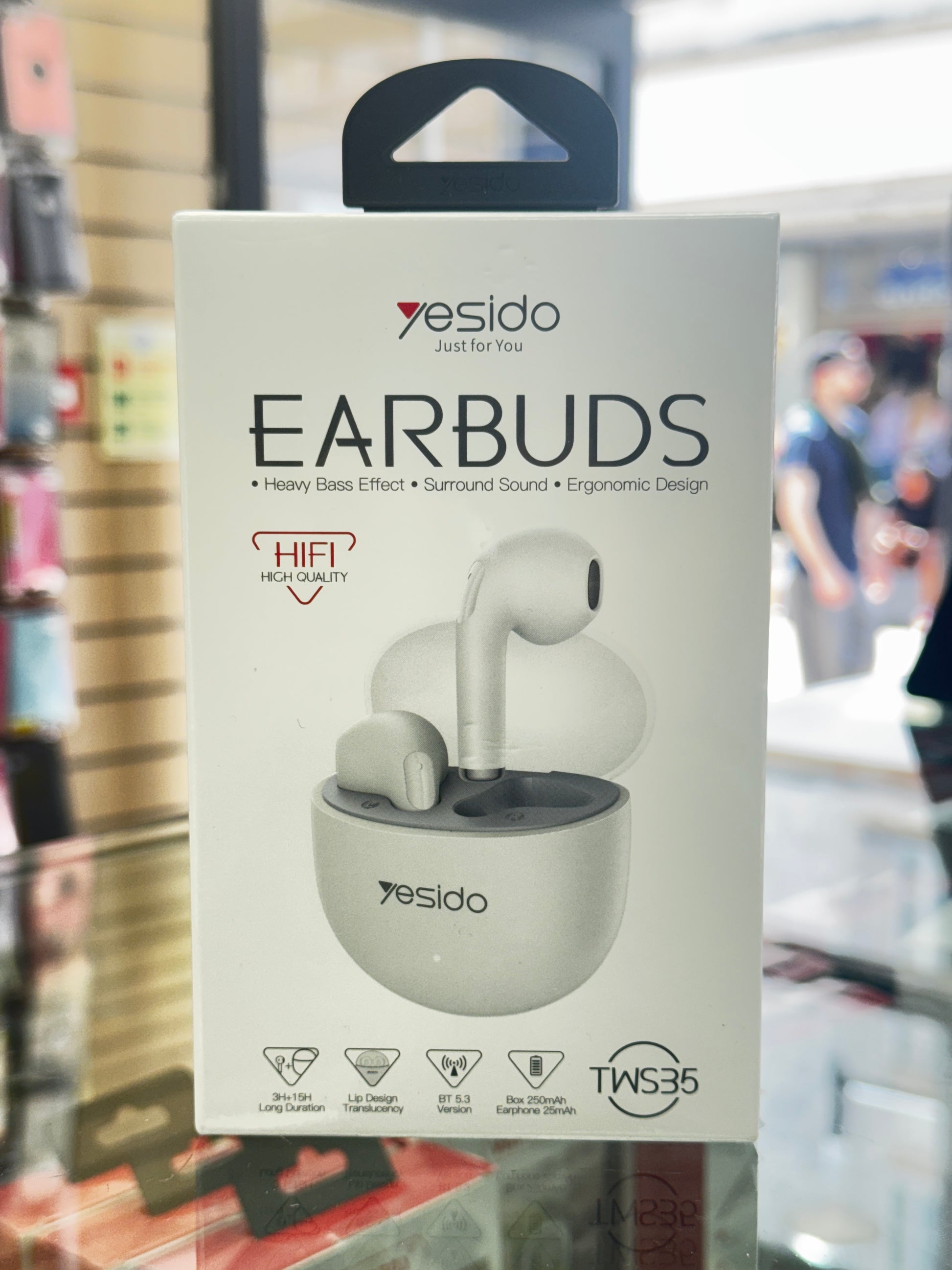 Yesido earbuds packaging with a blurred store background