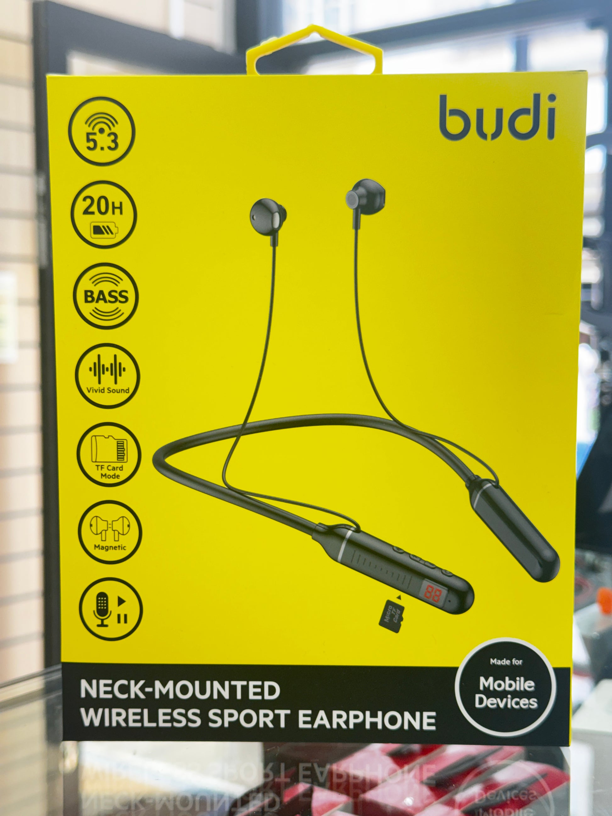 Yellow packaging box for neck-mounted wireless sport earphones with 'budi' branding.